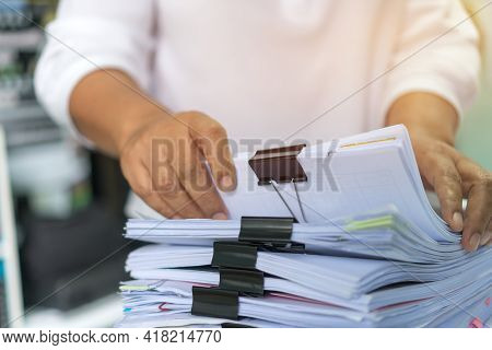 Office Workers Arranging Stacks Of Lot Documents Report Papers With Clips Waiting Be Managed On Desk