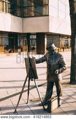 Monument To The Artist With Easel In Budapest. Monument To Ignatius Roshkovich.