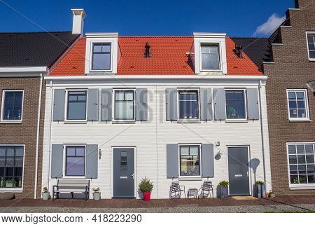 White House With Gray Shutters In Blauwestad, Netherlands