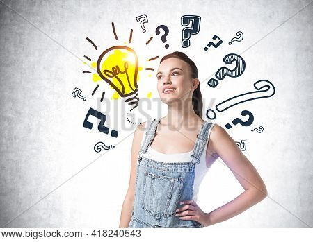 Woman In Jumpsuit Smiling, Pensive And Inspired Look. Background Of Doodle Question Marks And Yellow