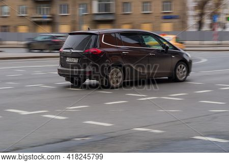 Brown Opel Zafira Tourer C On The City Road. Fast Moving Compact Mpv On Moscow Streets With Motion B