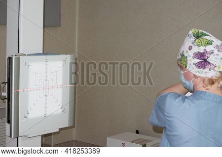 The Work Of A Radiologist In The X-ray Room For Diagnostics.
