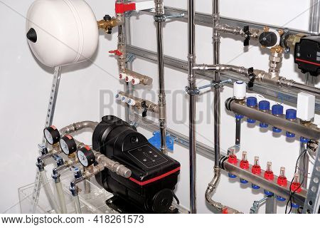 Plumbing Services. Stainless Steel Piping Of The Heating System In The Boiler Room. Heating Thermore