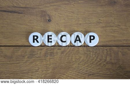 Recap Symbol. The Word 'recap' On White Circles On Beautiful Wooden Table. Beautiful Wooden Backgrou