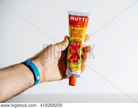 Paris, France - Jul 30, 2017: Pov Male Hand Holding Isolated On White Background Mutti Triple Tomato
