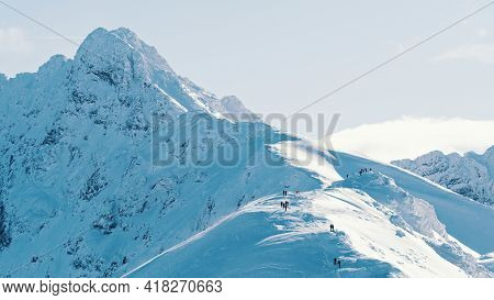 Snow-capped Mountain Peak With Clear Sky In The Background - Winter Mountains. High Quality Photo