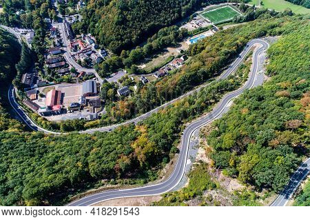 Winding Road Serpentine From A High Mountain Pass In The Rhine Village Bendorf Sayn Germany Aerial V