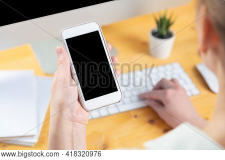 Hands Of Women Who Use Laptop Keyboard And Mobile Phone. Concept Of Email Delivery And Use Of Online