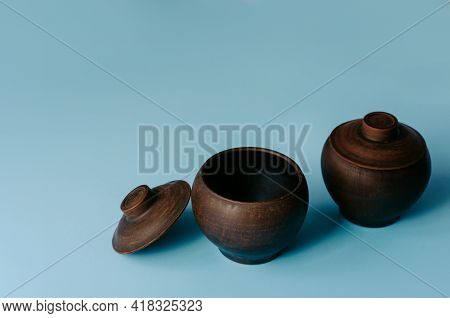 Clay Dishes On Blue Background, Rural Dishes.