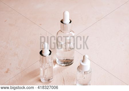 Eco Mineral Oil In Amber Glass Bottles With Pipette. Transparent Hyaluronic Serum Gel And Skin Care