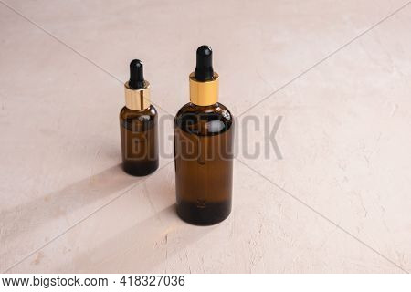 Eco Mineral Oil In Amber Glass Bottles With Pipette. Transparent Hyaluronic Serum Gel And Skin Care