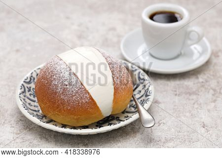  homemade Maritozzo is italian roman breakfast sweet that whipped cream sandwished between brioche.
