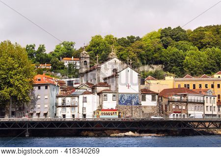 Houses and  cathedral (built in 1394 ) in old part of Ribeira, Douro river, Porto, Portugal. UNESCO world heritage site