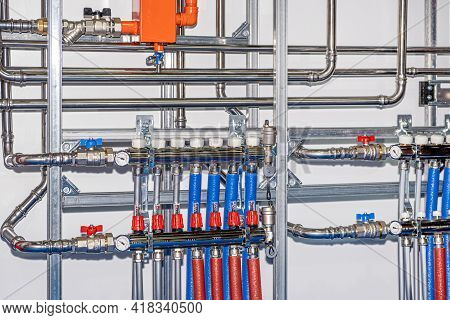 Plumbing Services. Stainless Steel Piping Of The Heating System In The Boiler Room. Heating Thermore