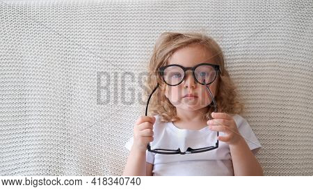 Funny Toddler Cute Girl Wear Different Glasses.