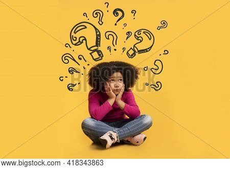 Confused Black Girl With Question Marks Above Her Head Thinking About Something, Unable To Find Solu