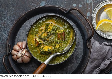 Traditional Indian Punjabi Food Palak Paneer With Spinach And Cheese In Vintage Metal Bowl With Spoo
