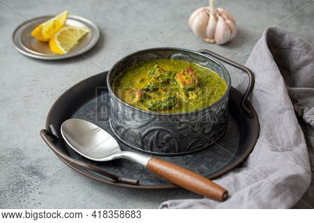 Traditional Vegetarian Indian Punjabi Food Palak Paneer With Spinach And Cheese In Vintage Metal Bow