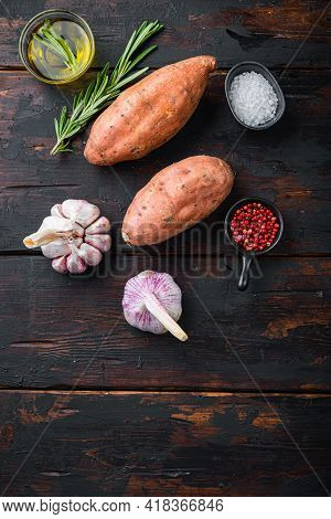 Sweet Potato Or Batat With Herbs On Old Wooden Table, Top View With Space For Text.
