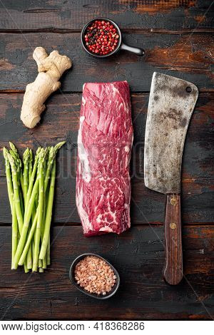 Gourmet Portion Of Raw Fresh Marbled Beef Fillet Set , With Old Butcher Cleaver Knife, On Old Dark  