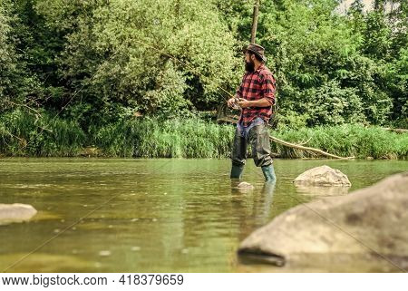 I Choose My Passion. Man Catching Fish. Mature Man Fly Fishing. Fisherman Show Fishing Technique Use