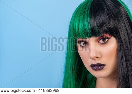 Beauty Portrait Of Young Woman Wearing Green Black Halh Color Wig, Black Lips Makeup, Clean Skin. Bl