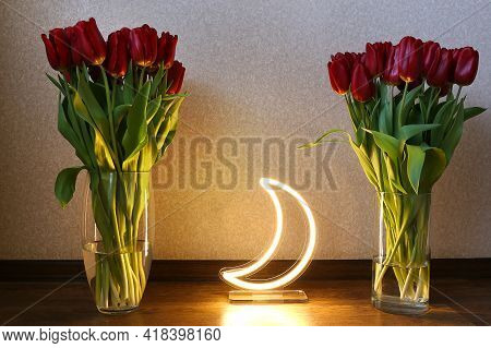 Neon Moon Sign With Beautiful Red Tulips. Trendy Style. Floral Background. Neon Sign. Custom Neon. H