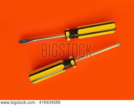 Screwdriver On A Colored Background Construction Steel