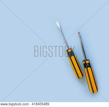 Screwdriver On A Colored Background Construction Steel