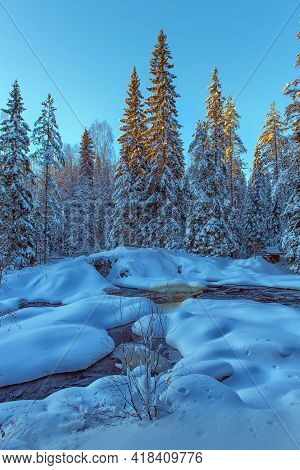 Winter Landscape, Snow Covered Trees And A Stream In Winter