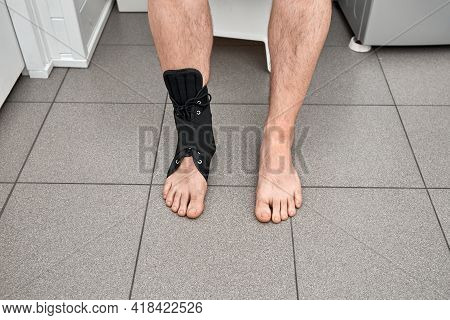 The Male Leg Is Fixed In A Medical Bandage. Ankle Fracture Or Sprain. Lacing And Tight Fit Of The Fo