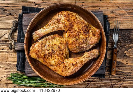Bbq Grilled Chicken Legs In A Wooden Plate With Herbs. Wooden Background. Top View