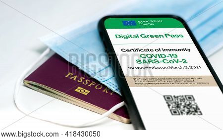The Digital Green Pass Of The European Union With The Qr Code On The Screen Of A Mobile Phone Over A