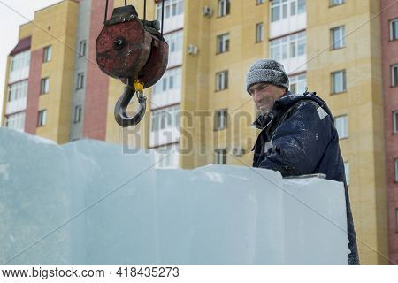 A Portrait Of A Fitter In A Blue Jacket At The Hook