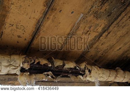 Torn Thermal Insulation On The Heating Pipes. Mismanagement Leads To Significant Economic And Ecolog