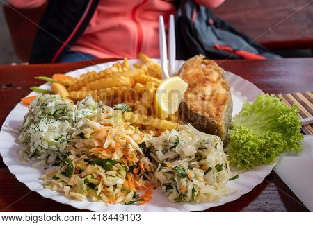 Fried Fish With Fries And Vegetable Salad