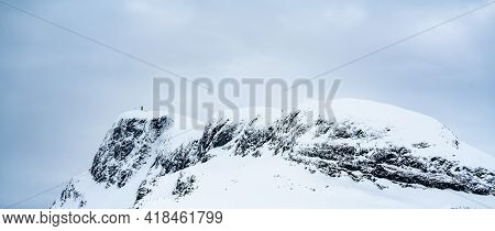 Mount Bitihorn Peak In Beitostølen Norway, Covered In Snow On A Cold Winters Day.