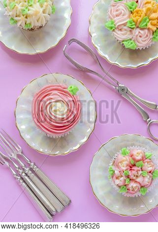 Vertical Overrview Image Of Pretty Delicately Cup Cakes Iced With  Russian  Piping Icing Tips ,pink 