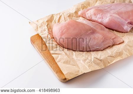 Raw Chicken Fillet On A White Acrylic Background