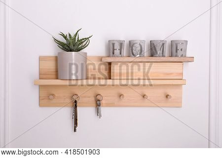 Wooden Hanger For Keys With Decor On White Wall