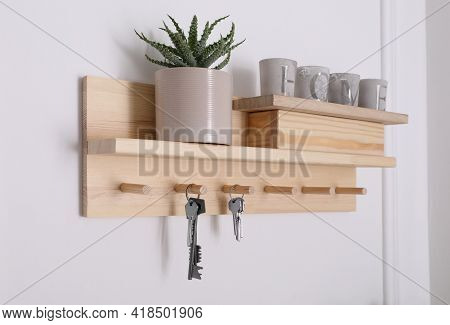 Wooden Hanger For Keys With Decor On White Wall