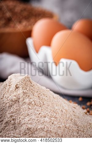 Fresh Natural Buckwheat Flour On A Dark Stone Background Culinary Concept