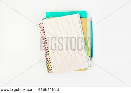 Chool Notepad On Blue Background, Spiral Notepad With Blank Page And Ballpoint Pen On Table Top View