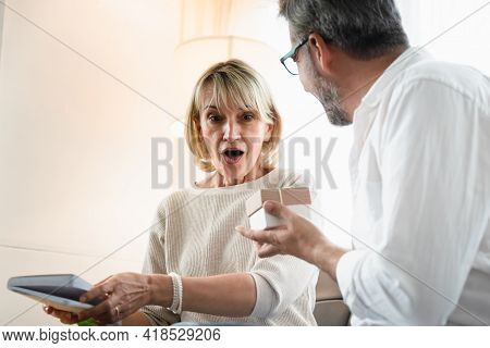 Elderly Woman Surprisingly Face While Looking At The Present That Her Husband Give To Her, Romantic 