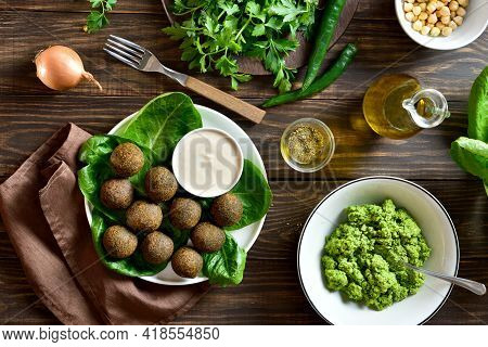 Falafel Balls. Deep Fried Balls From Ground Chickpeas. Traditional Middle Eastern Food. Wooden Backg
