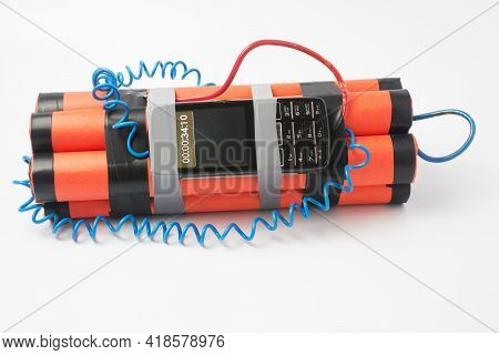 Ready Assembled Bomb With A Clockwork From An Old Smartphone Rewound With Electrical Tape On A White