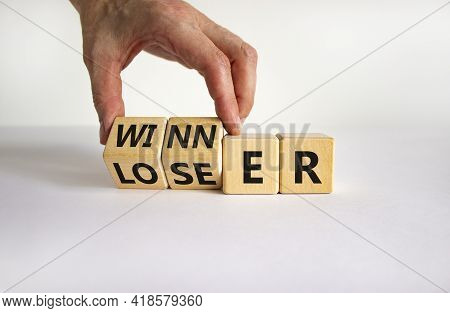 Loser Or Winner Symbol. Businessman Turns Cubes And Changes The Word 'loser' To 'winner'. Beautiful 