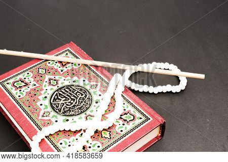 Quran Is Your Guidance Of Your Life Concept With The Koran, Prayer Beads And Pointer. Large Writen A