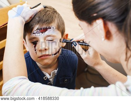 Little Cute Child Making Facepaint On Birthday Party, Zombie Apocalypse Facepainting, Halloween Prep