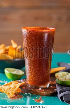 Mexican Alcohol Cocktail Michelada With Dark Beer And Lime Juice